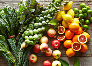 a group of fruits and vegetables on a wood surface Healthy Weight Loss Diets Ilford