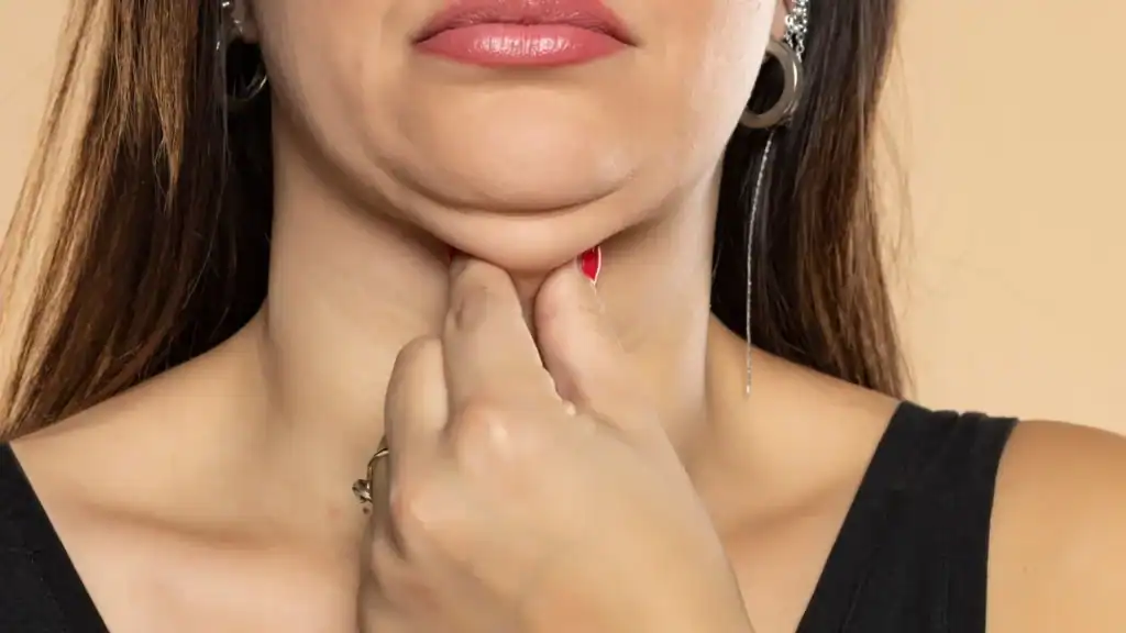 An image of a woman with double chin, sad, worried : Non Surgical Double Chin Removal Treatment in Ilford, UK
